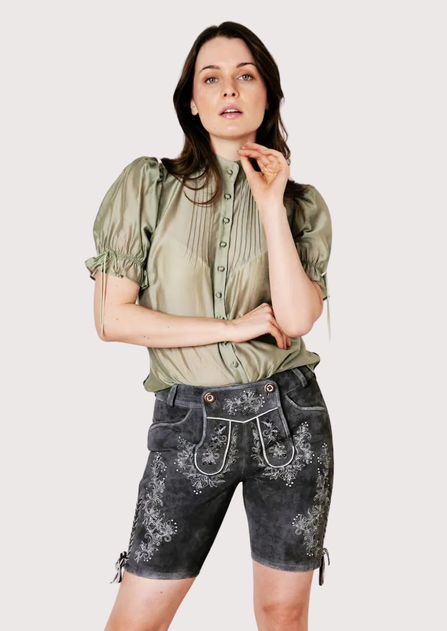 Premium women’s lederhosen with floral embroidery, perfect for Oktoberfest and cultural events.