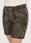 Women's aged suede Bavarian lederhosen featuring traditional embroidery and heritage Alpine styling.