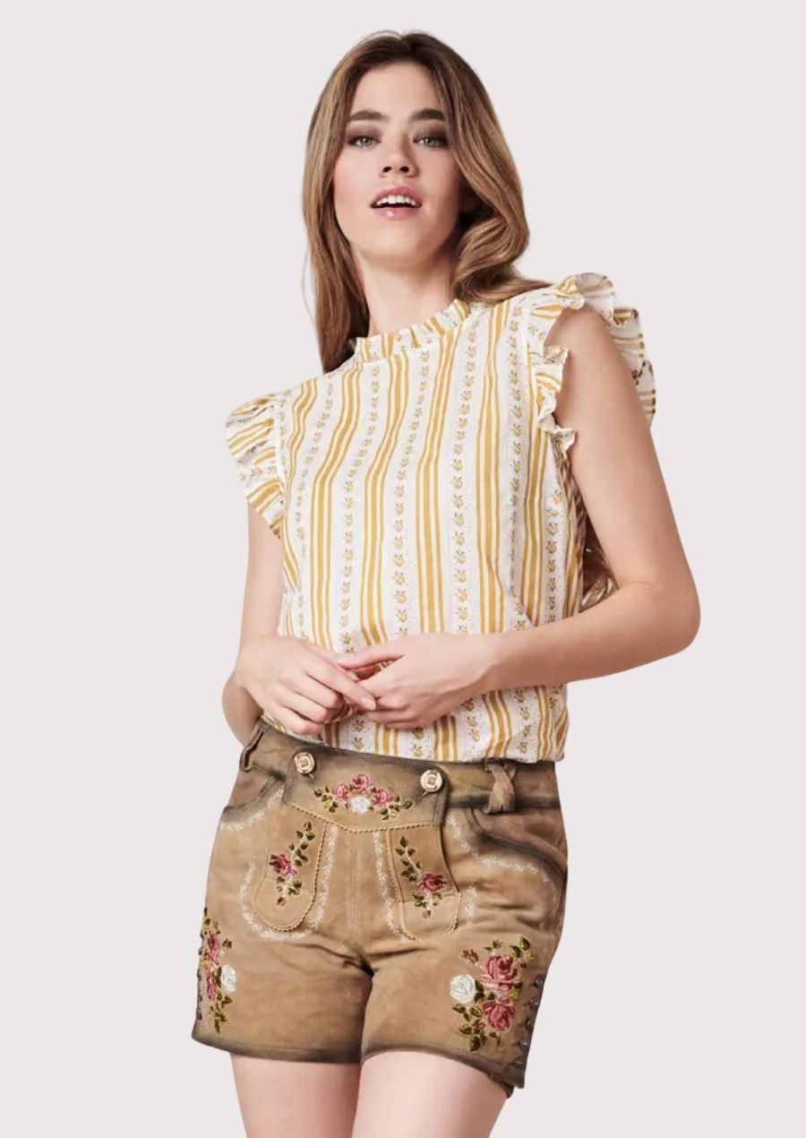 Alpine floral leather shorts for women crafted from soft tan suede with intricate embroidery and heritage-inspired design.