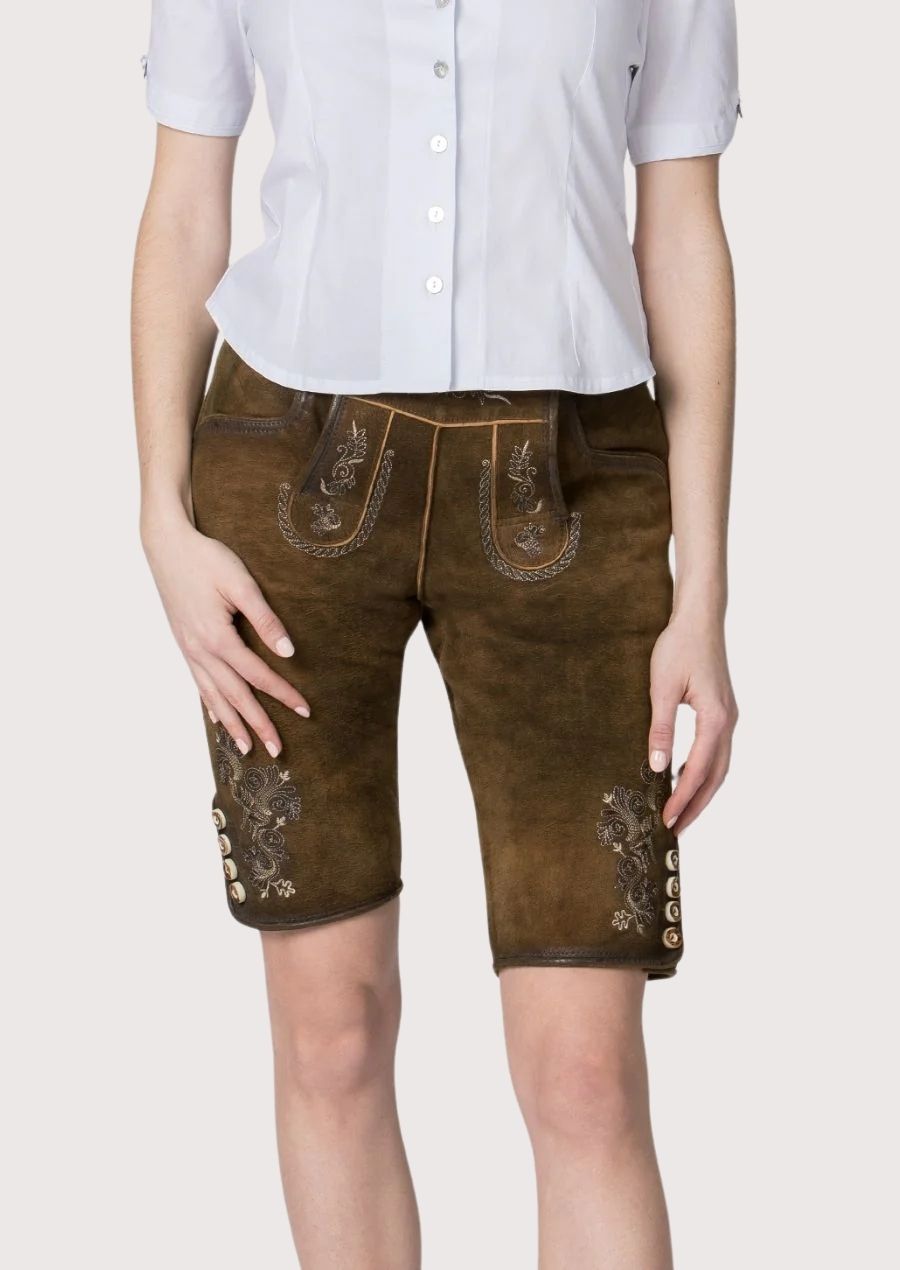 Women's Alpine heritage lederhosen featuring traditional embroidery, premium suede leather, and classic Trachten design.