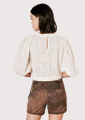 Alpine-inspired women's leather shorts with embroidered motifs, vintage styling, and authentic folk fashion character.