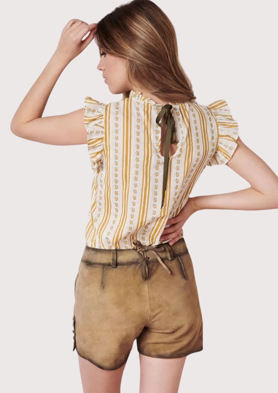 Artisan floral women's lederhosen style showcasing embroidered blooms, premium suede construction, and Alpine elegance.