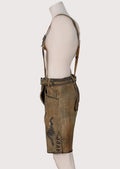 Authentic Bavarian lederhosen outfit featuring embroidered leather braces, brown suede finish, and classic German styling