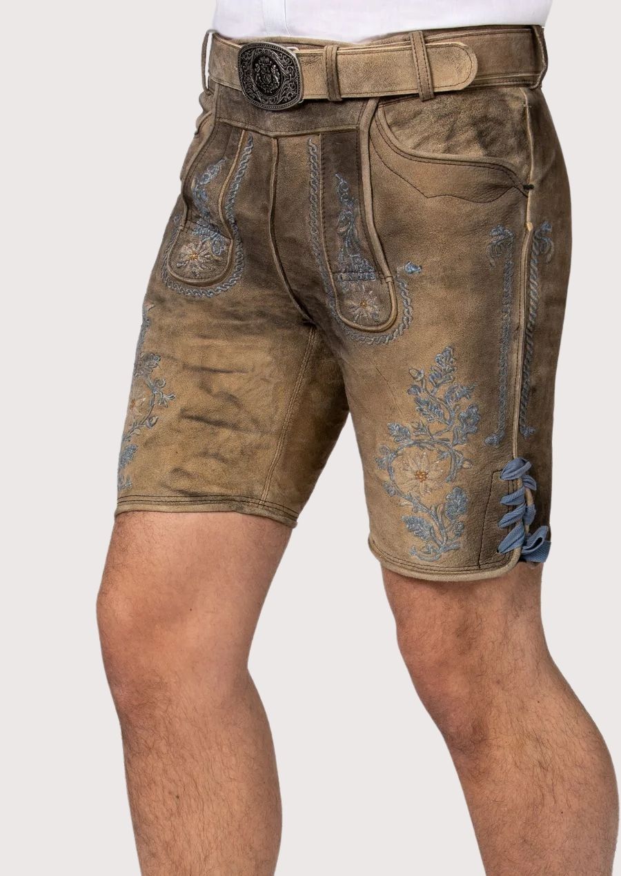 Men’s Bavarian Lederhosen featuring intricate floral designs and antique-style buttons.

