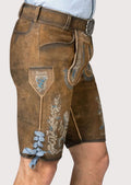 Rustic brown suede lederhosen showcasing blue-and-white embroidery and heritage German styling