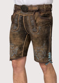 Authentic Bavarian lederhosen shorts crafted from distressed brown suede with detailed blue embroidery