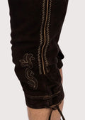 Authentic German lederhosen with suspenders, detailed embroidery, and classic Oktoberfest-inspired construction