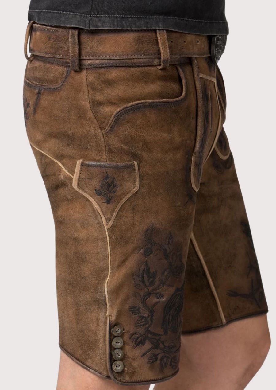 Premium brown suede lederhosen combined with a skull graphic t-shirt for modern Oktoberfest styling