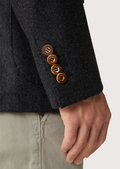 Close-up of antique-style buttons on Alpine heritage jacket