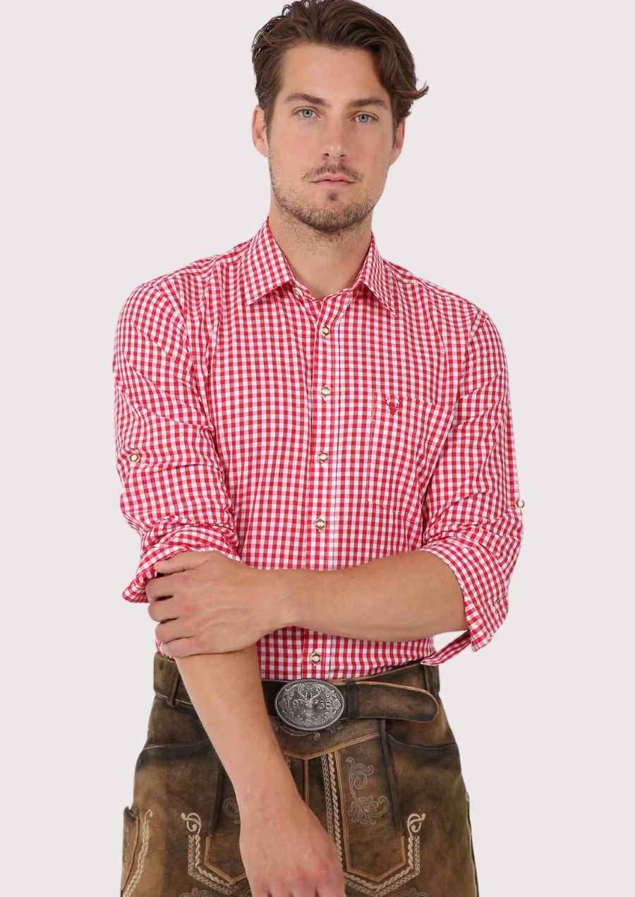 Man wearing red checkered Bavarian Trachten shirt and traditional leather lederhosen

