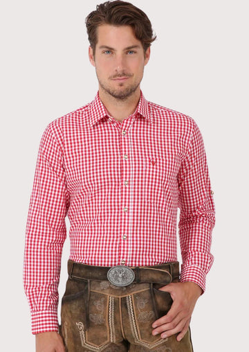 Man wearing red checkered Bavarian Trachten shirt and traditional leather lederhosen

