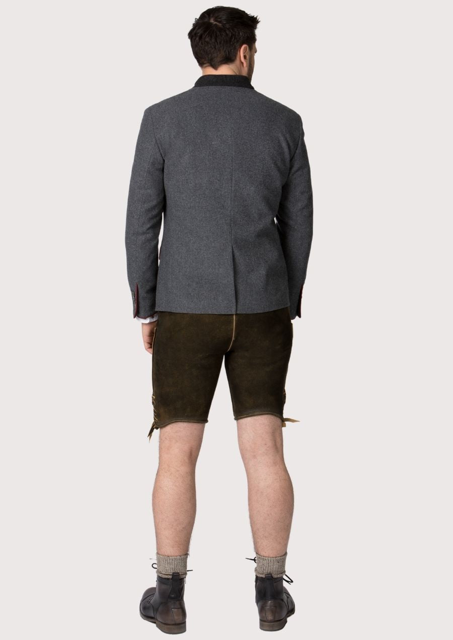 Men’s Oktoberfest jacket with stylish red piping and horn buttons, a timeless piece for German heritage celebrations like Oktoberfest and Bavarian weddings.
