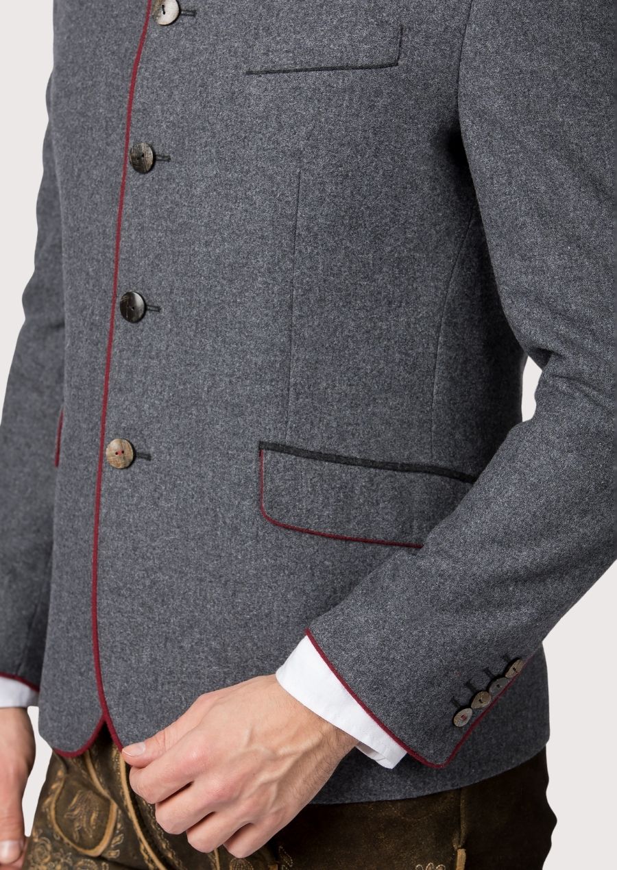 Stylish German-inspired Oktoberfest jacket for men with horn buttons and red piping, perfect for both Oktoberfest celebrations and traditional Bavarian gatherings.