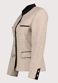 Beige women’s alpine jacket with black trim and structured tailoring.