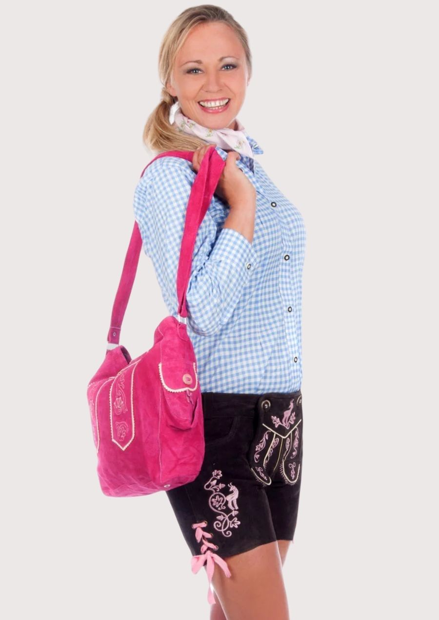 Black Bavarian lederhosen with elegant pink embroidered details, traditional styling, and premium suede appearance.