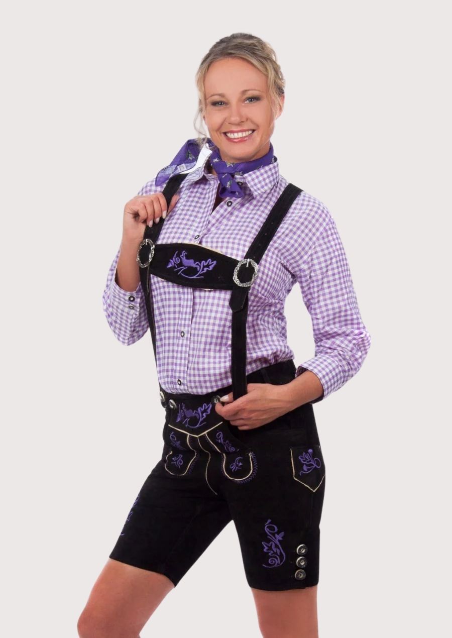 Black Bavarian lederhosen with striking purple embroidery, traditional suspenders, and premium suede craftsmanship.