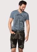 Black goatskin suede lederhosen featuring silver skull embroidery, side lacing and rugged Bavarian styling