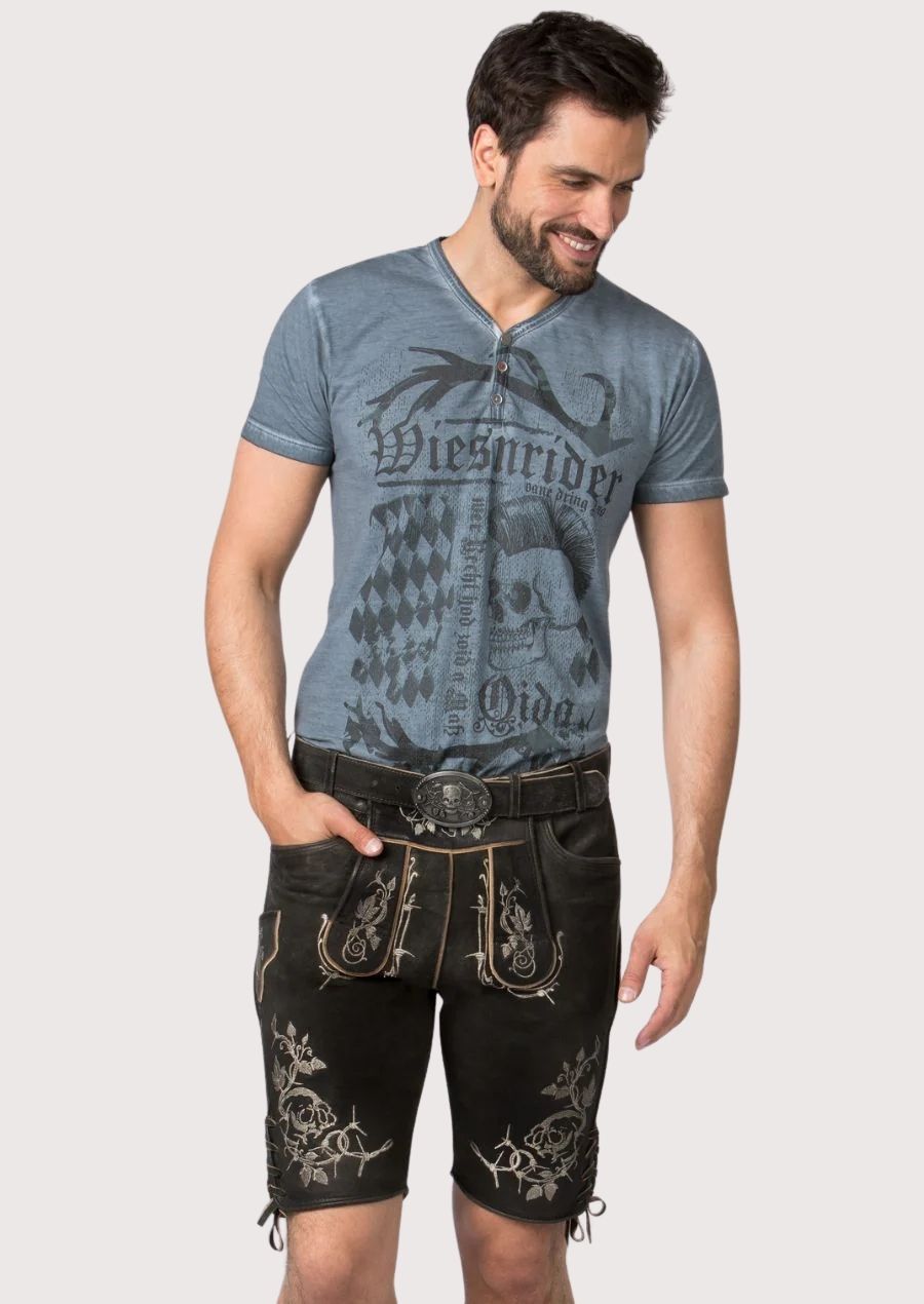 Black goatskin suede lederhosen featuring silver skull embroidery, side lacing and rugged Bavarian styling