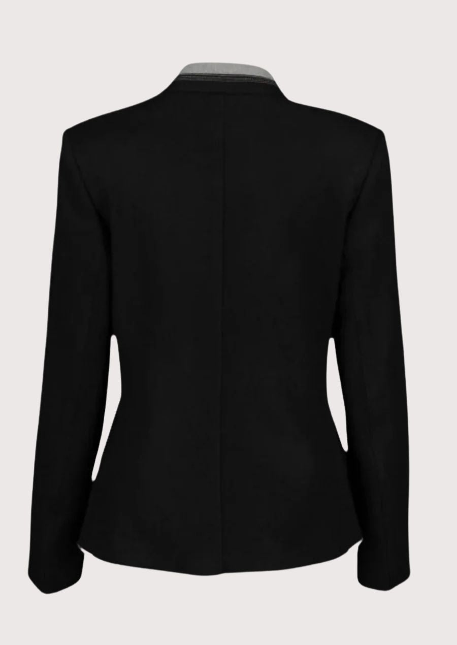 Black women’s alpine jacket with silver buttons and contrast piping.