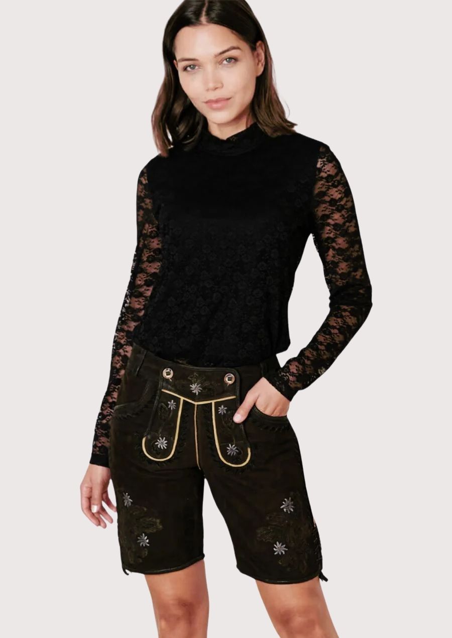 Women's heritage black lederhosen shorts with embroidered Edelweiss details, rustic suede texture, and classic Alpine charm.