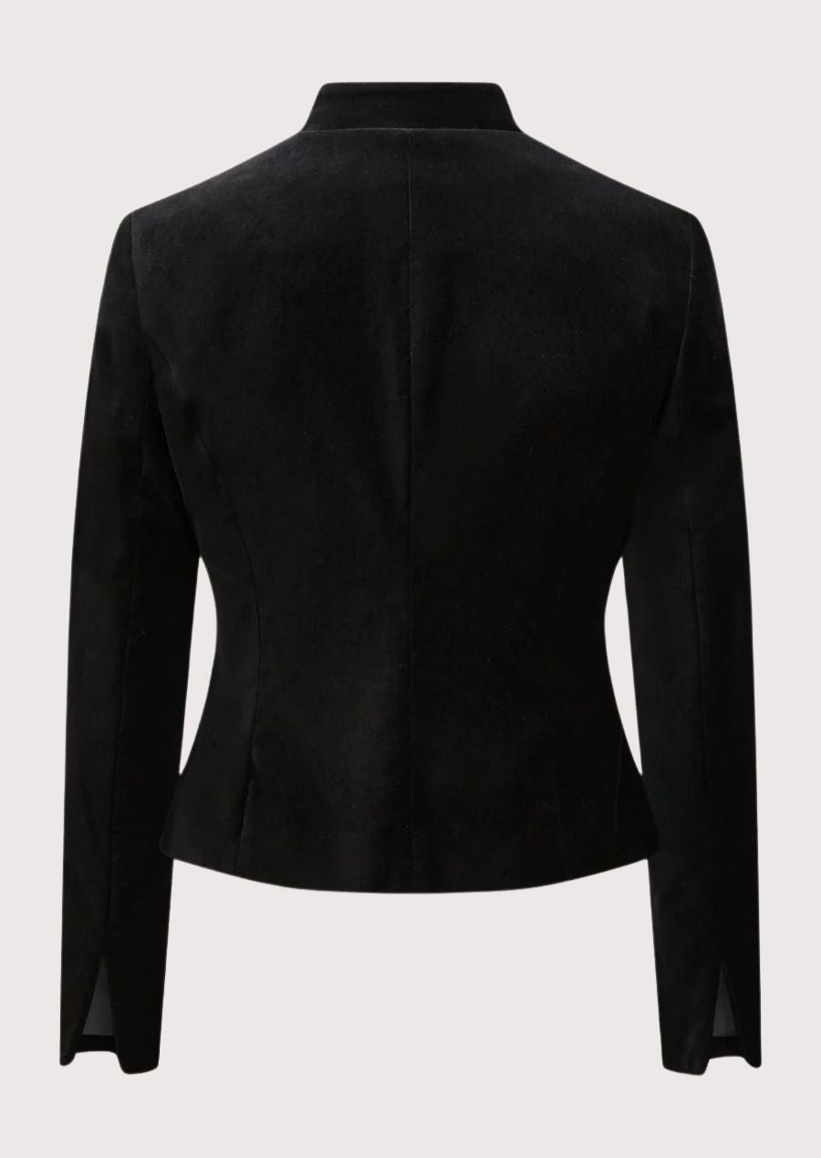 Black women’s trachten jacket with stand collar, gold buttons, and alpine tailoring.