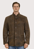 Brown leather Trachten jacket featuring a classic stand collar, smooth suede texture, front button closure, and traditional Bavarian alpine craftsmanship.