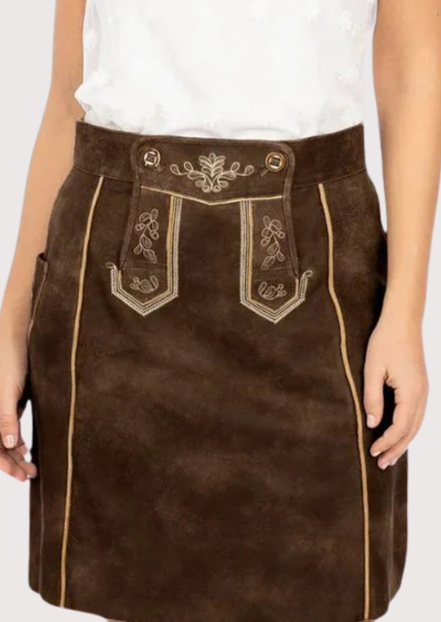 Brown women’s lederhosen-style skirt featuring traditional alpine embroidery, decorative front flap, and classic Bavarian folk fashion design.