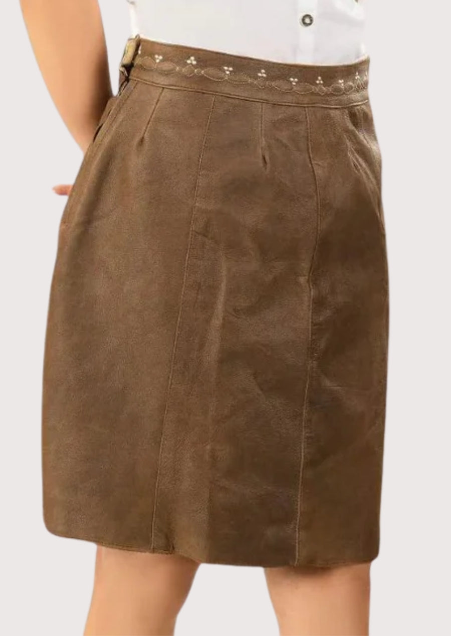  women’s brown suede trachten skirt with high waist, smooth panel design, and traditional alpine folkwear styling.