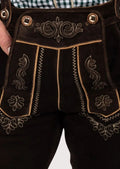 Stylish men’s Bundhosen made from premium suede leather, featuring floral embroidery and adjustable cuffs, ideal for beer festivals and traditional gatherings.