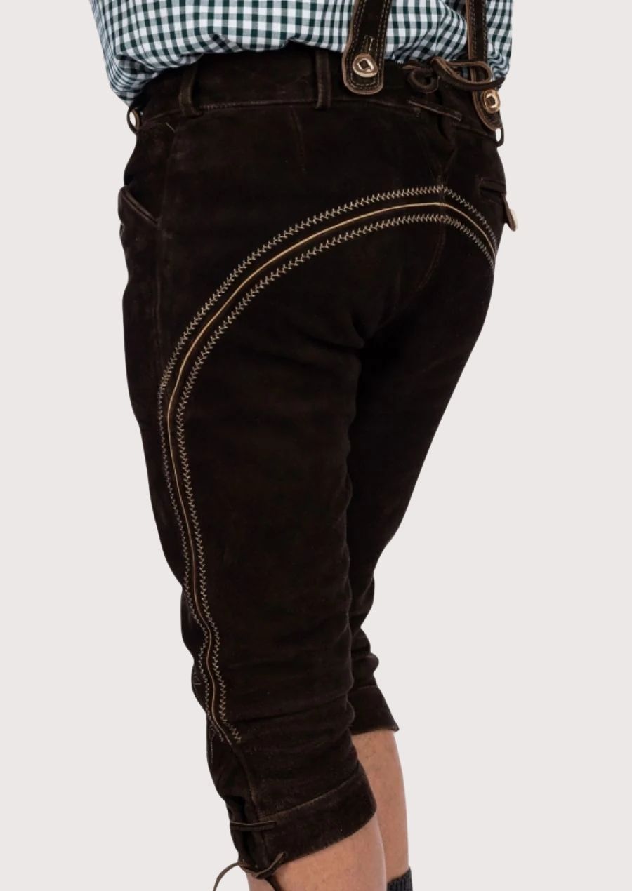 Men’s Bundhosen made from premium suede leather, featuring detailed floral embroidery and adjustable suspenders, perfect for Oktoberfest and festive gatherings.