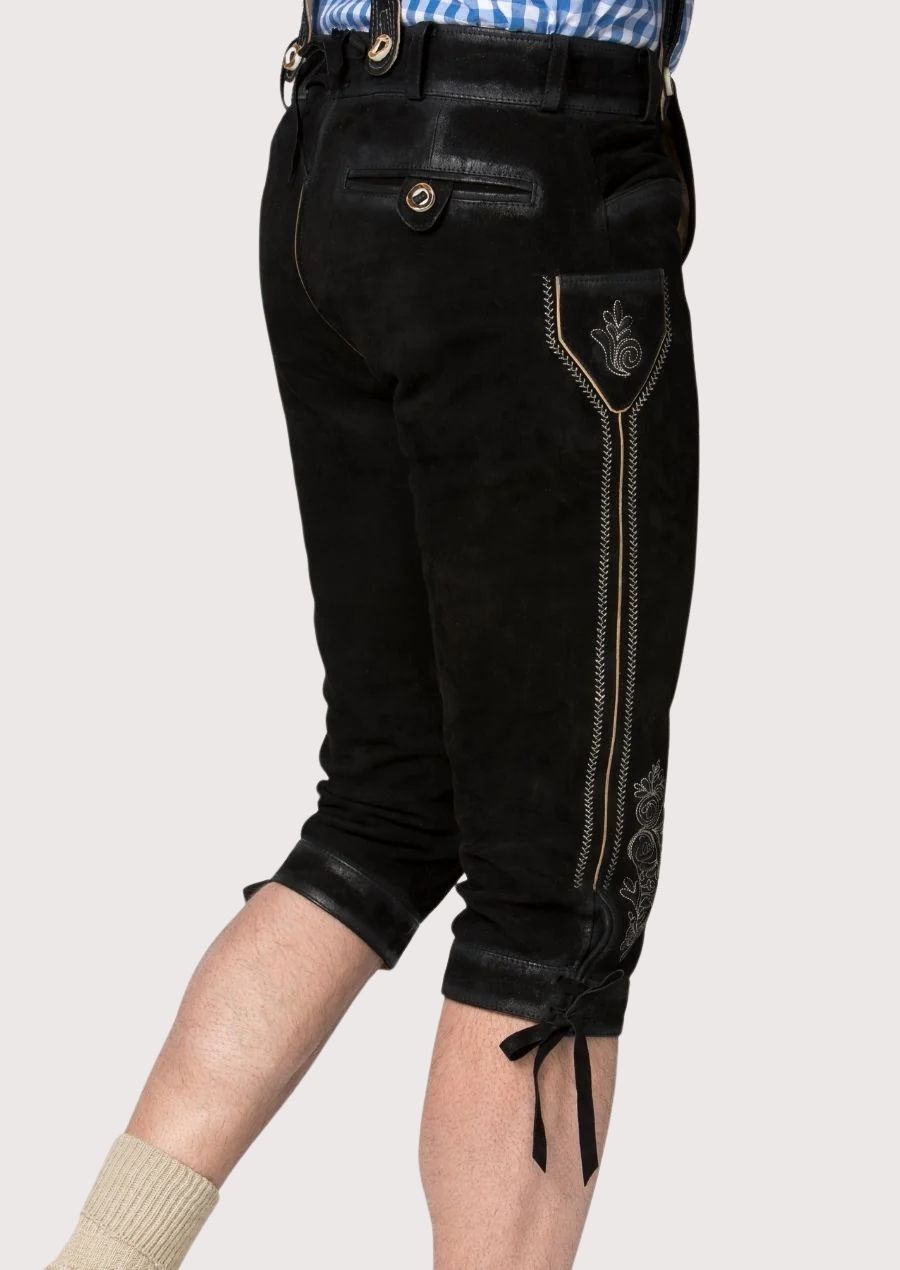 Stylish men’s Bundhosen made from durable suede leather, featuring metal button closures and floral embroidery, perfect for Bavarian cultural events and festivals.