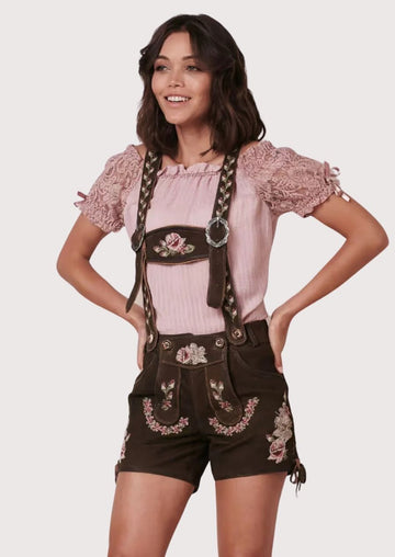 Chic Lederhosen for women featuring intricate floral embroidery, perfect for Oktoberfest and cultural events.