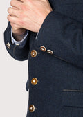 Classic alpine men’s jacket crafted from dark blue wool fabric.