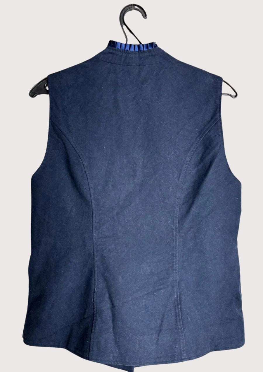 Traditional women’s navy vest with decorative neckline trim.