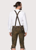 Classic brown Bundhosen with suspender buttons, decorative stitching, and handcrafted Bavarian details