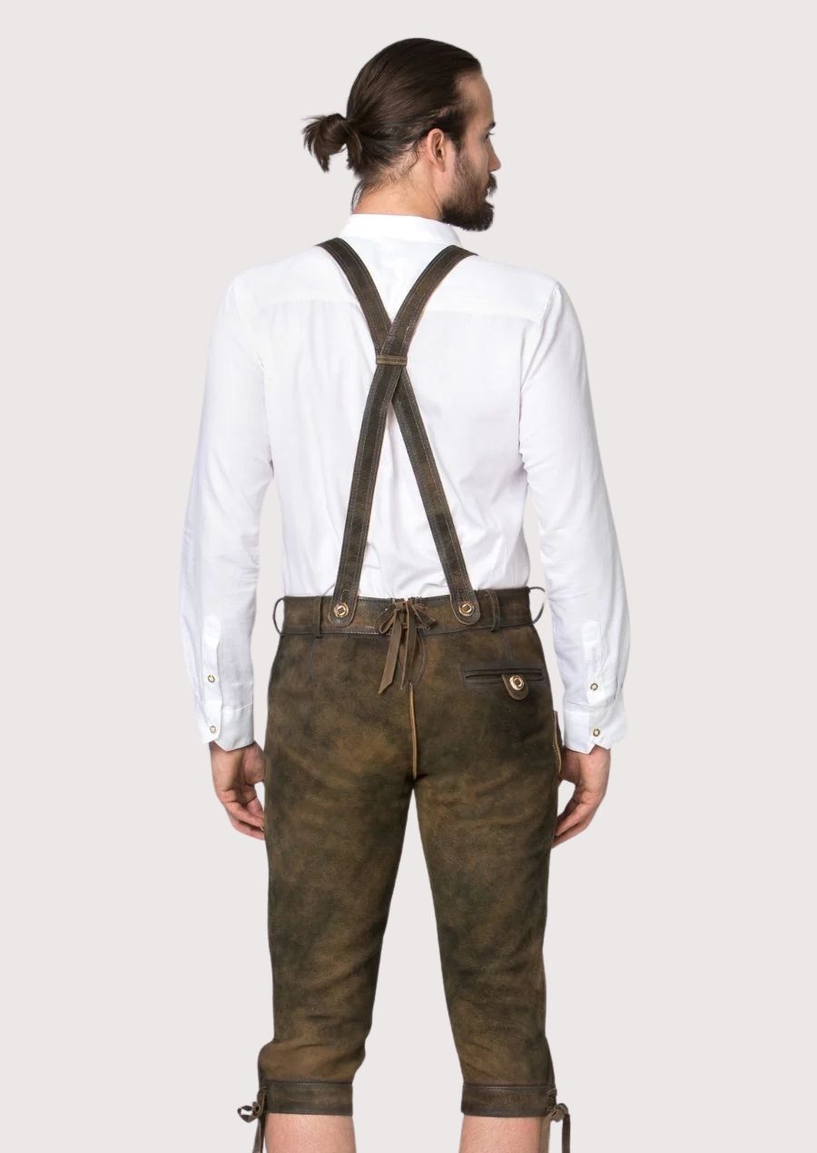Classic brown Bundhosen with suspender buttons, decorative stitching, and handcrafted Bavarian details