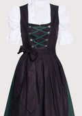 Classic folk dirndl green trim with black apron, lace-up corset bodice, white puff sleeve blouse, traditional Bavarian Oktoberfest outfit, authentic German Alpine clothing.