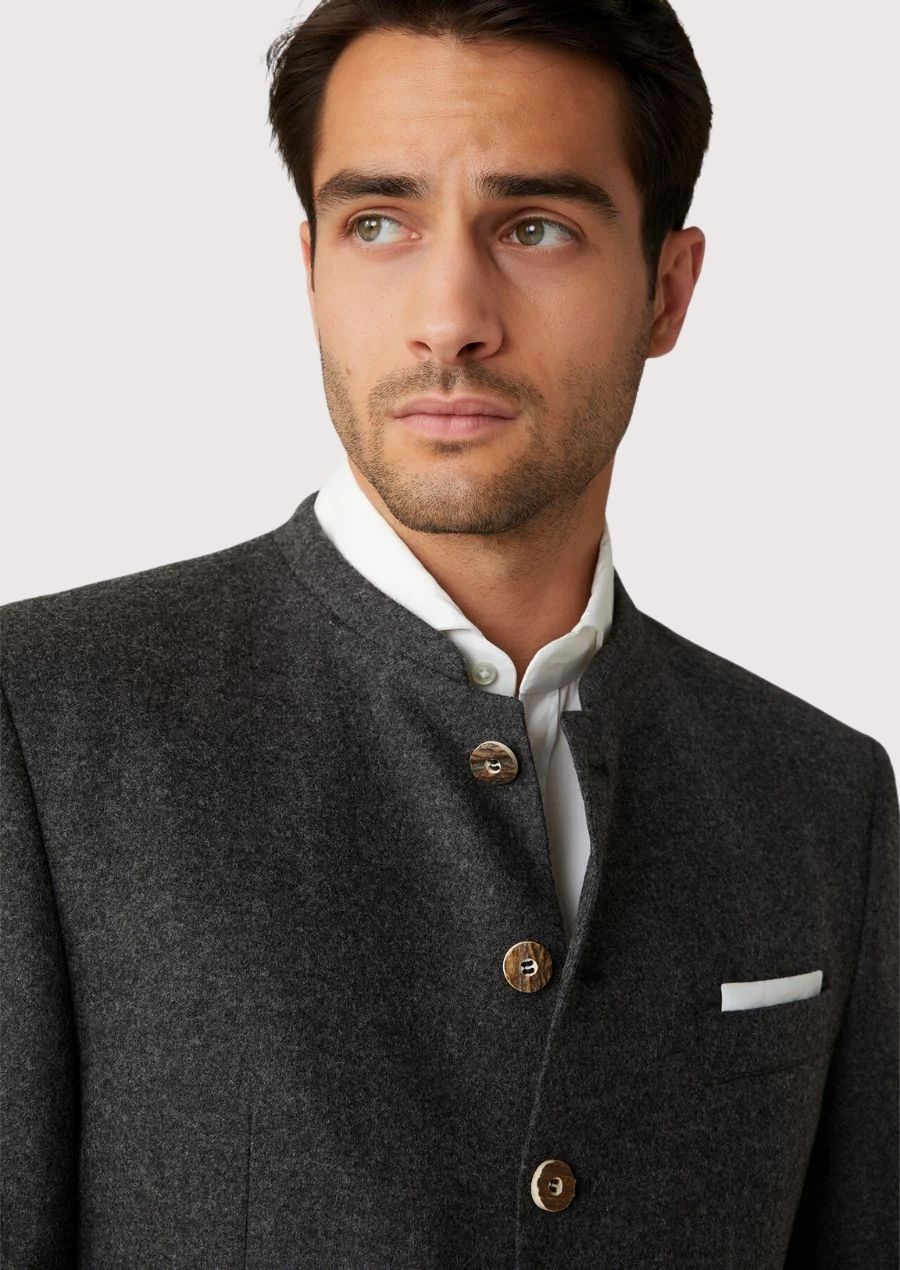 German Trachten wool jacket in dark charcoal, displaying front buttoned design and rear tailored panel with traditional heritage craftsmanship.