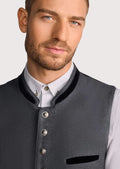 Classic German waistcoat paired with white shirt and alpine trousers