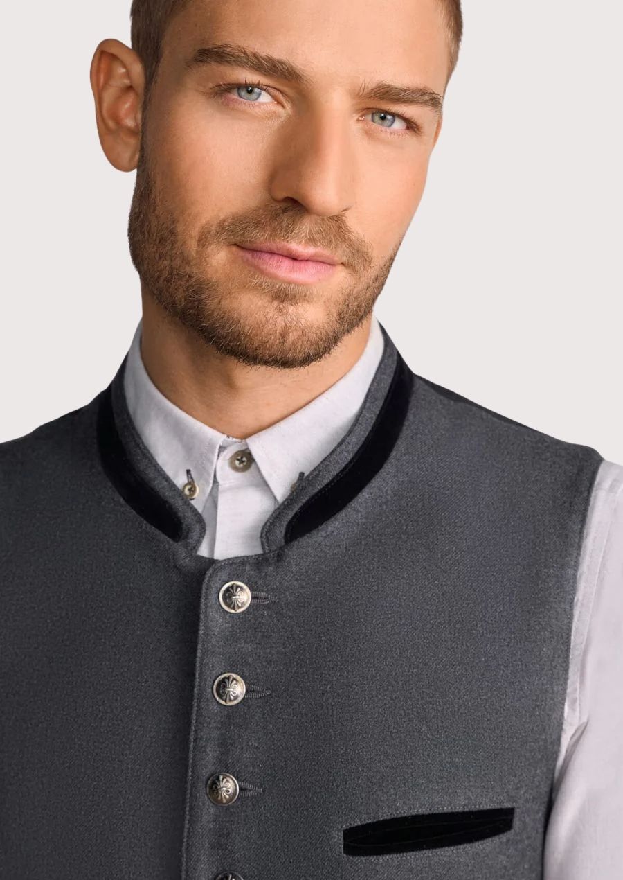 Classic German waistcoat paired with white shirt and alpine trousers