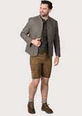 Classic alpine men’s jacket in grey wool with front button closure.