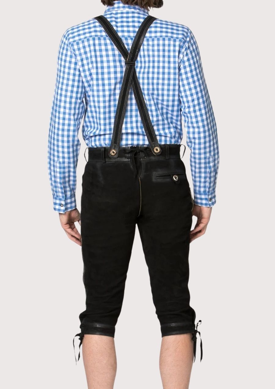Classic Oktoberfest black lederhosen trousers paired with suspenders and intricate traditional embroidery
