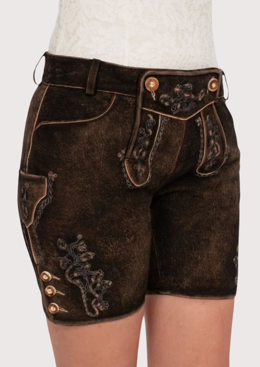 Dark rustic lederhosen for women featuring embroidered detailing, traditional flap front, and authentic Alpine craftsmanship.