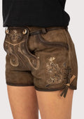Women's lederhosen featuring Edelweiss-inspired embroidery, vintage suede texture, and traditional German styling.