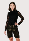 Elegant black Bavarian lederhosen for women with decorative embroidery, heritage craftsmanship, and authentic German appeal.