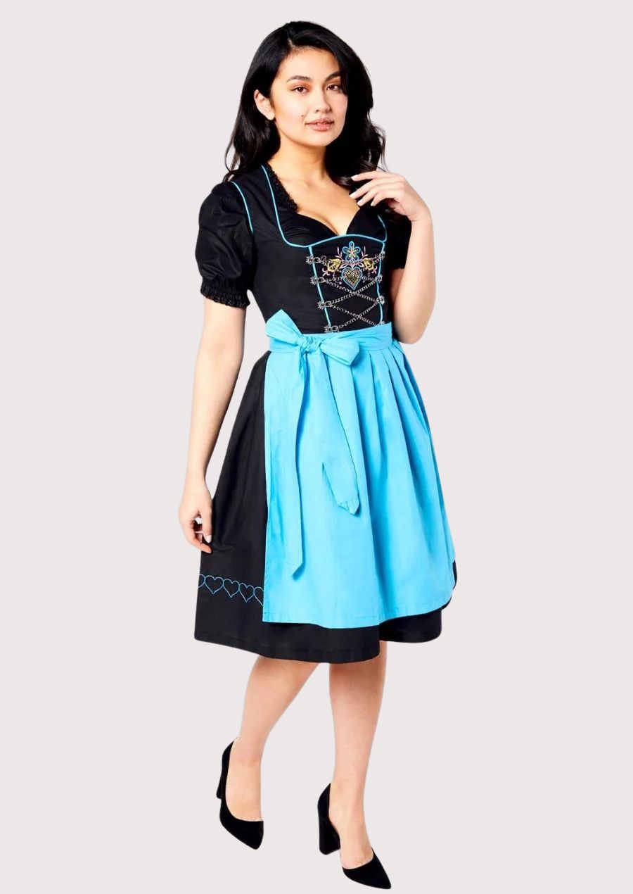 Elegant black Oktoberfest Dirndl featuring turquoise blue trim, matching apron, decorative corset lacing, and a feminine Alpine silhouette.