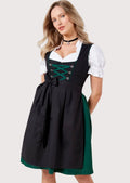 Elegant Bavarian Dirndl with an emerald green corset bodice, decorative silver hooks, black apron, white blouse, and timeless Alpine fashion.