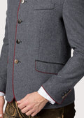 Elegant grey wool trachten jacket finished with red contrast trim.