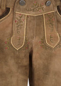 Traditional lederhosen for women in brown leather with floral detailing, perfect for festivals