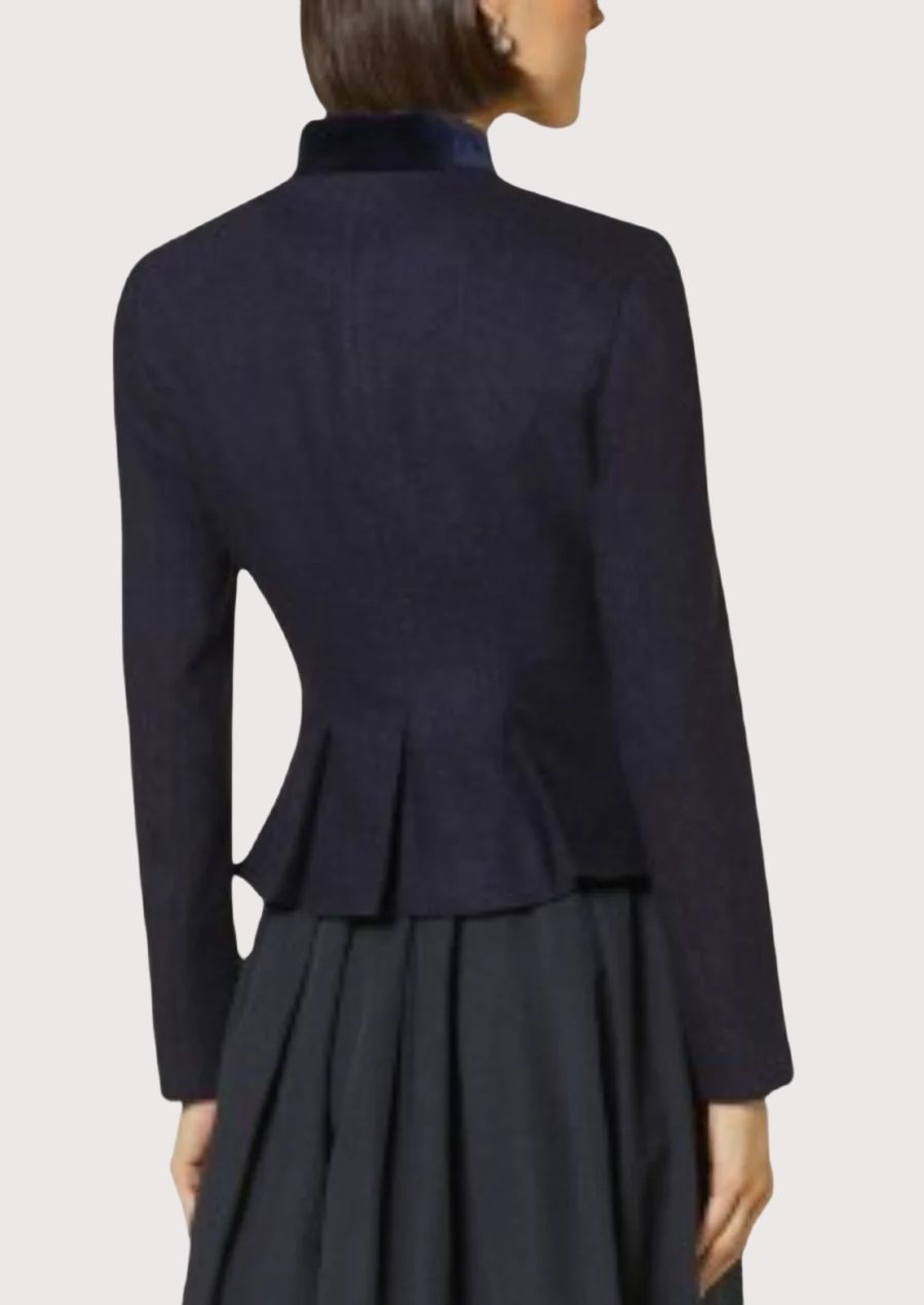 Elegant navy alpine jacket for women with long sleeves and refined heritage design.